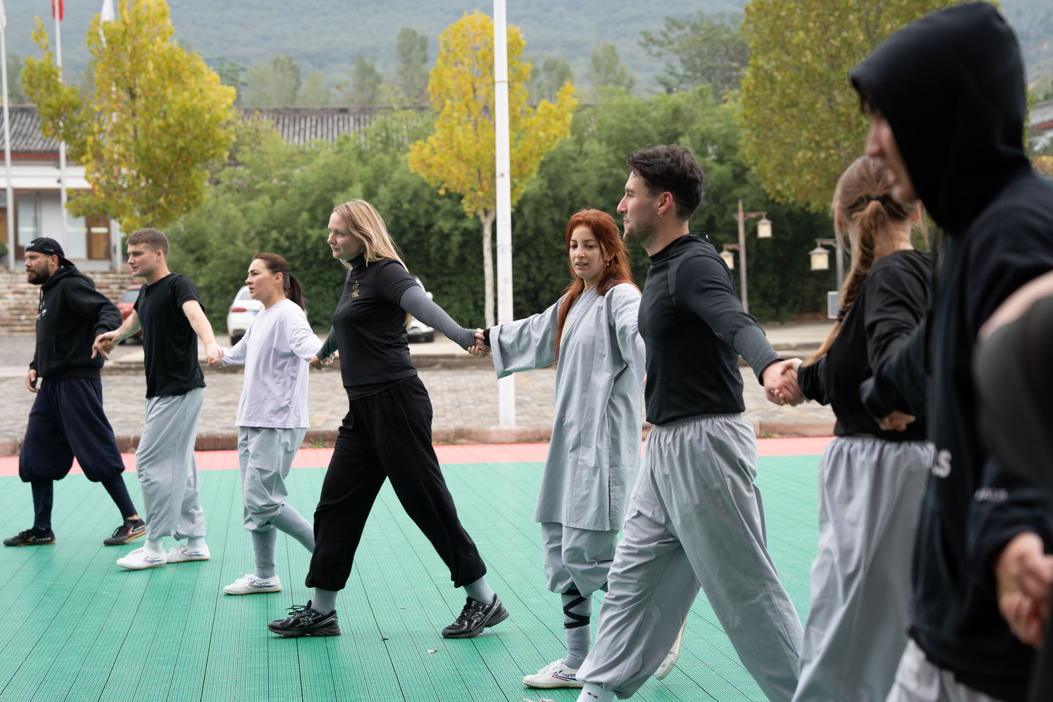 Students training together in the garden